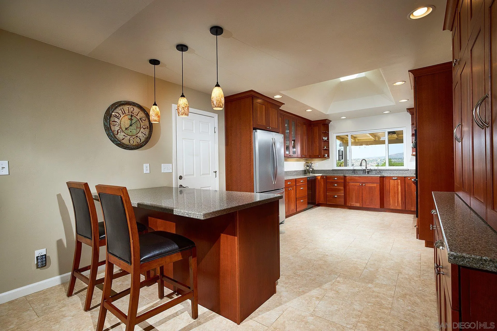 1076 Ranchito Vista Alpine, CA 91901 - Photo 8 of 57 a view of kitchen island with refrigerator furniture and wooden floor
