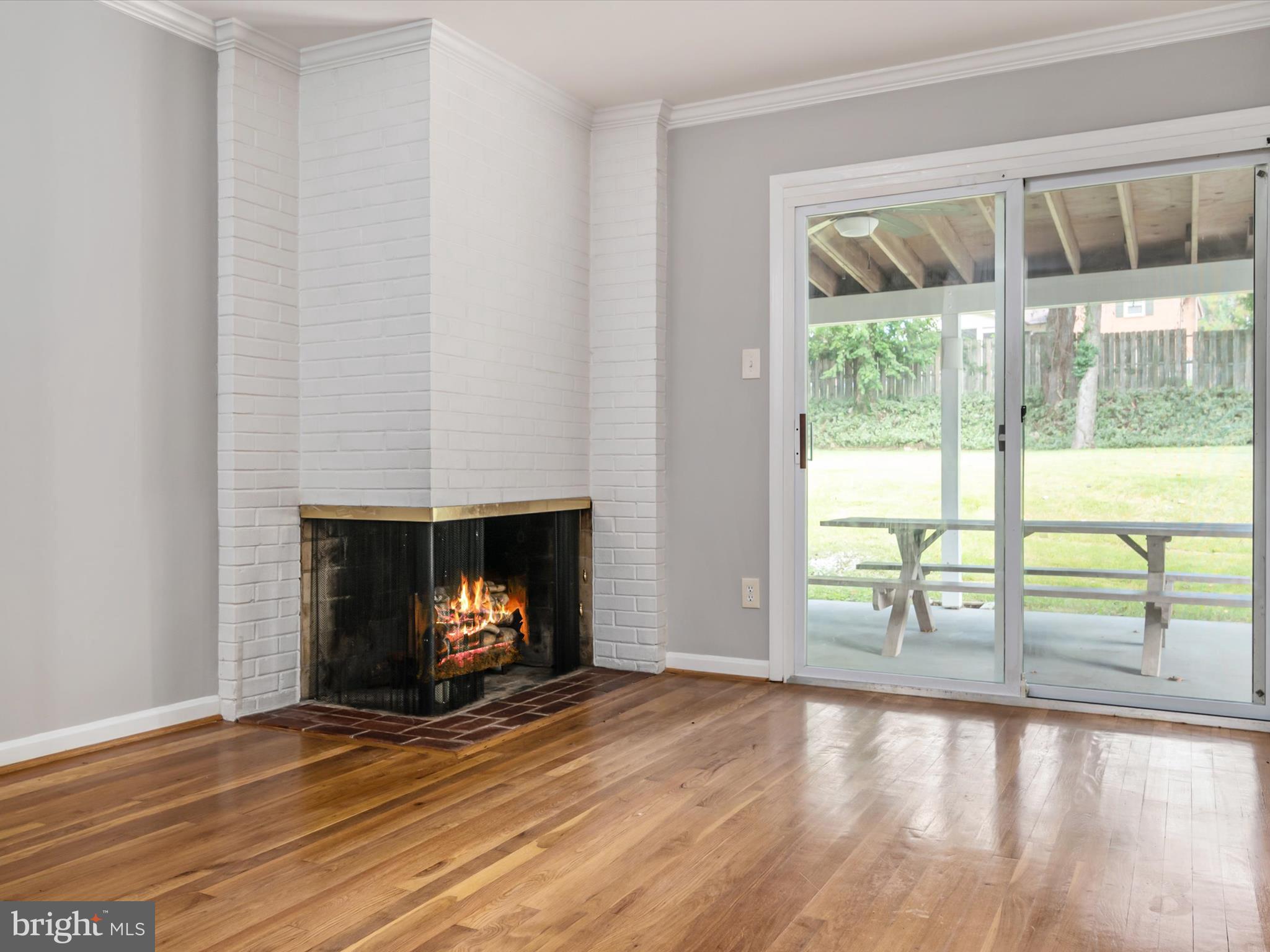 806 Downs Drive Silver Spring, MD 20904 - Photo 11 of 36 a view of an empty room with wooden floor and a window
