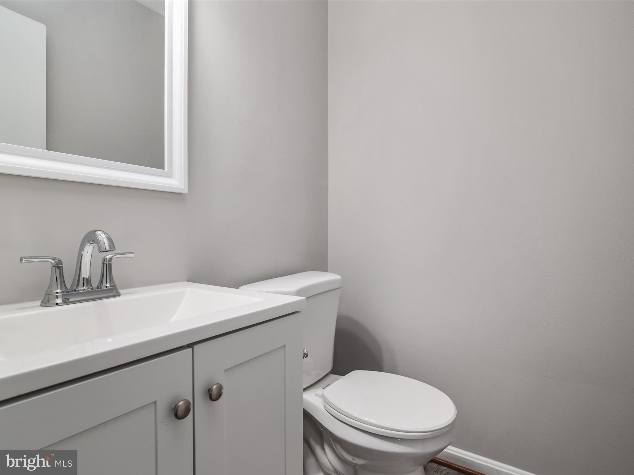 806 Downs Drive Silver Spring, MD 20904 - Photo 16 of 36 a bathroom with a sink a toilet and vanity
