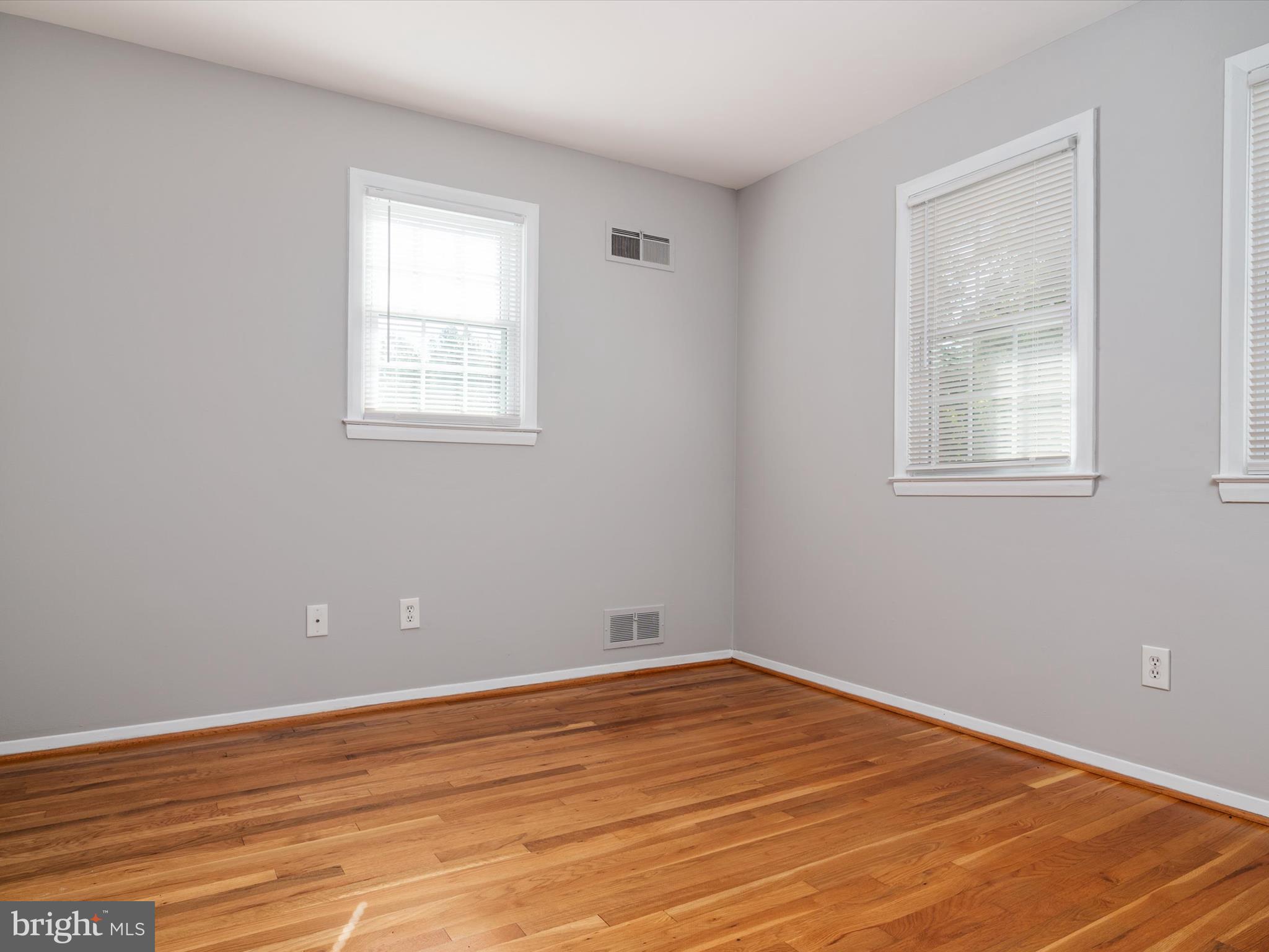 806 Downs Drive Silver Spring, MD 20904 - Photo 17 of 36 a view of empty room with wooden floor and fan