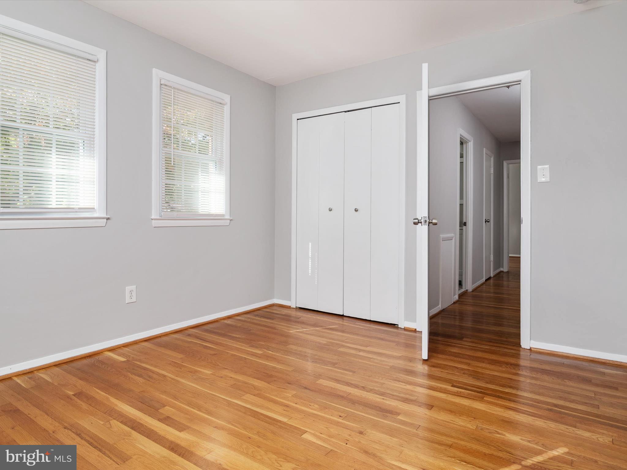 806 Downs Drive Silver Spring, MD 20904 - Photo 18 of 36 a view of an empty room with wooden floor and a window