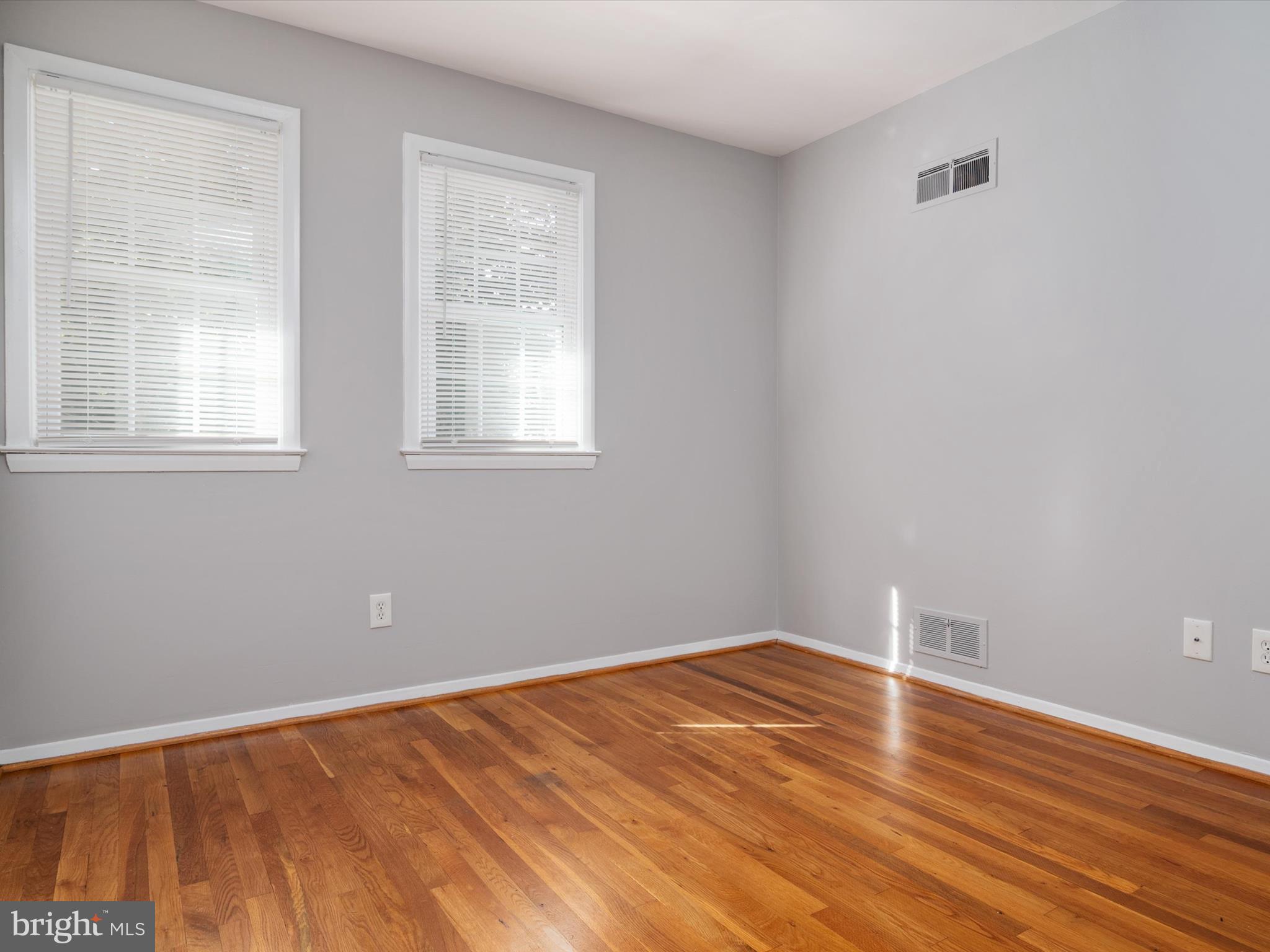 806 Downs Drive Silver Spring, MD 20904 - Photo 19 of 36 a view of an empty room with wooden floor and a window