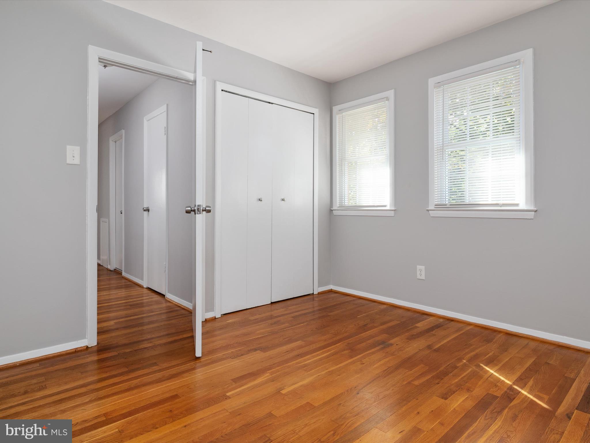 806 Downs Drive Silver Spring, MD 20904 - Photo 20 of 36 a view of an empty room with wooden floor and a window