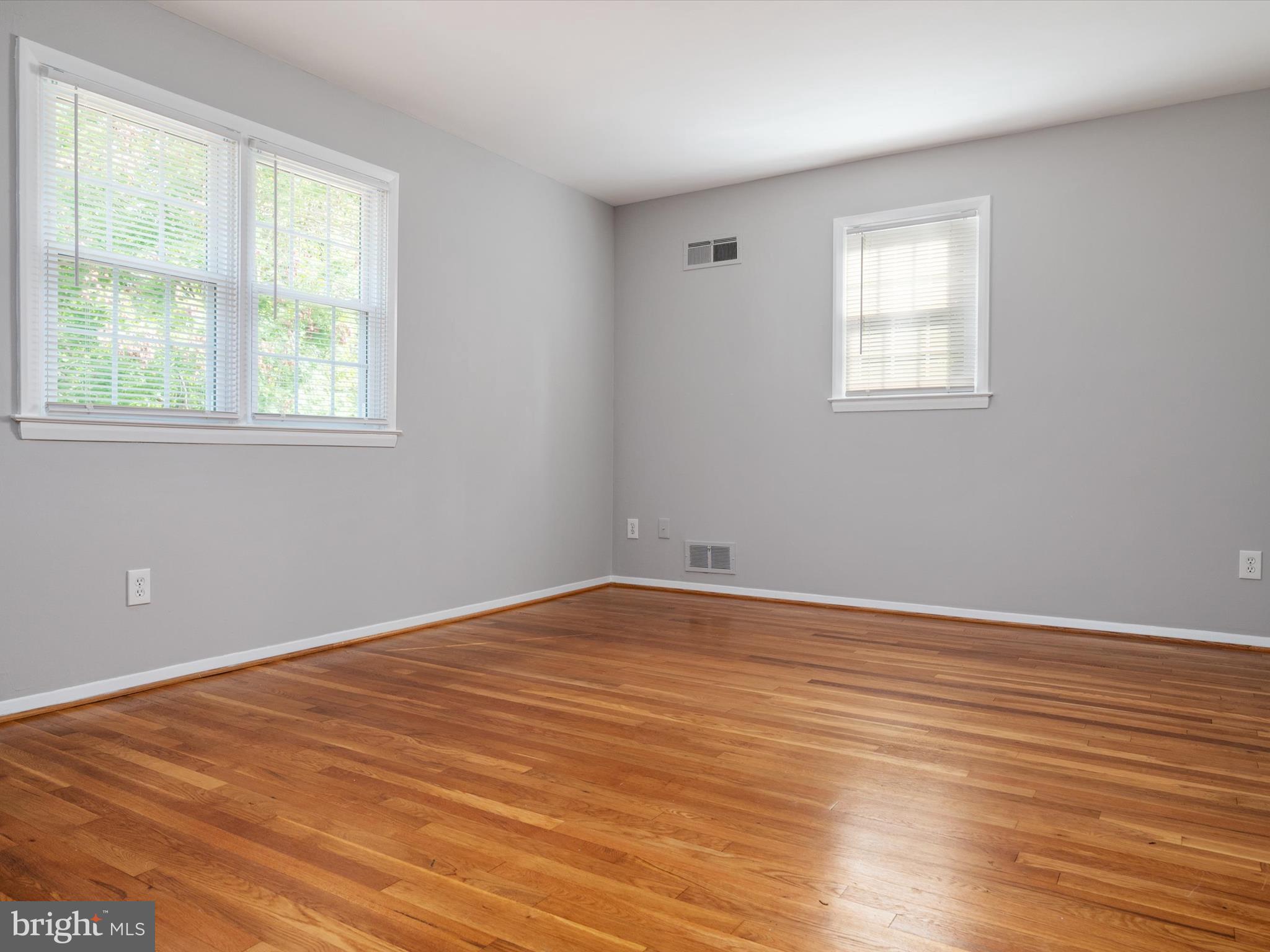 806 Downs Drive Silver Spring, MD 20904 - Photo 25 of 36 a view of an empty room with wooden floor and a window