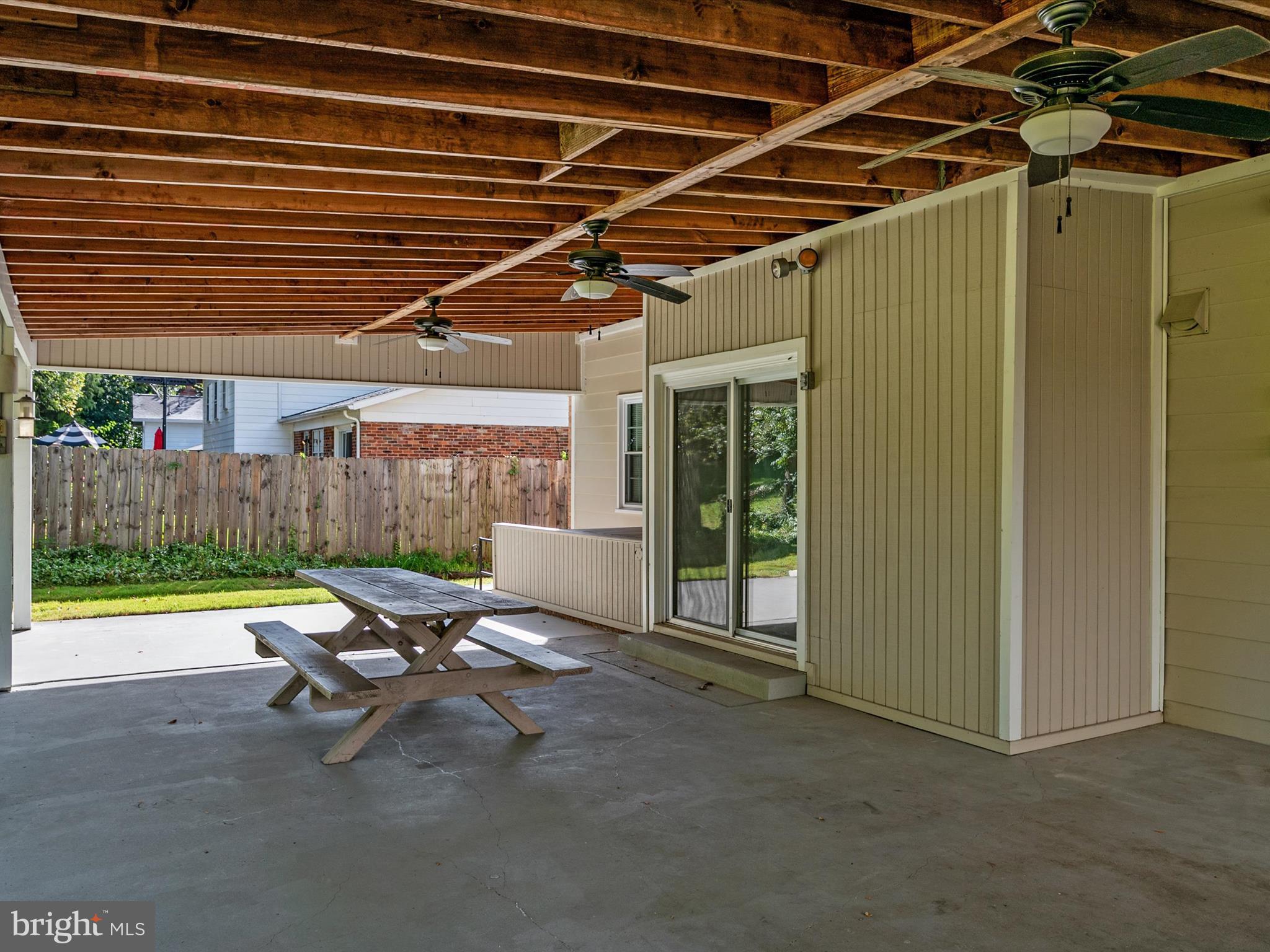806 Downs Drive Silver Spring, MD 20904 - Photo 35 of 36 a view of a patio with table and chairs with wooden floor