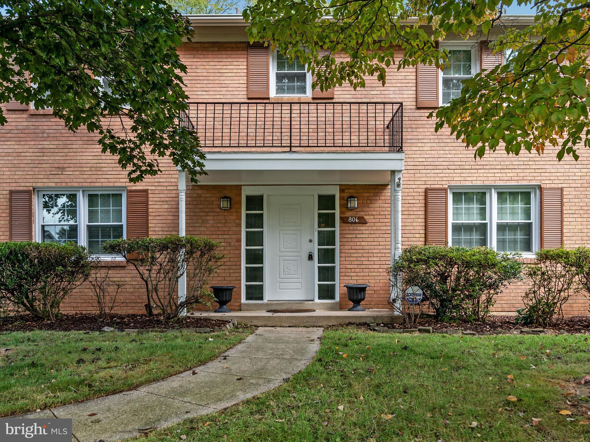 806 Downs Drive Silver Spring, MD 20904 - Photo 5 of 36 a view of a house with potted plants and a large tree