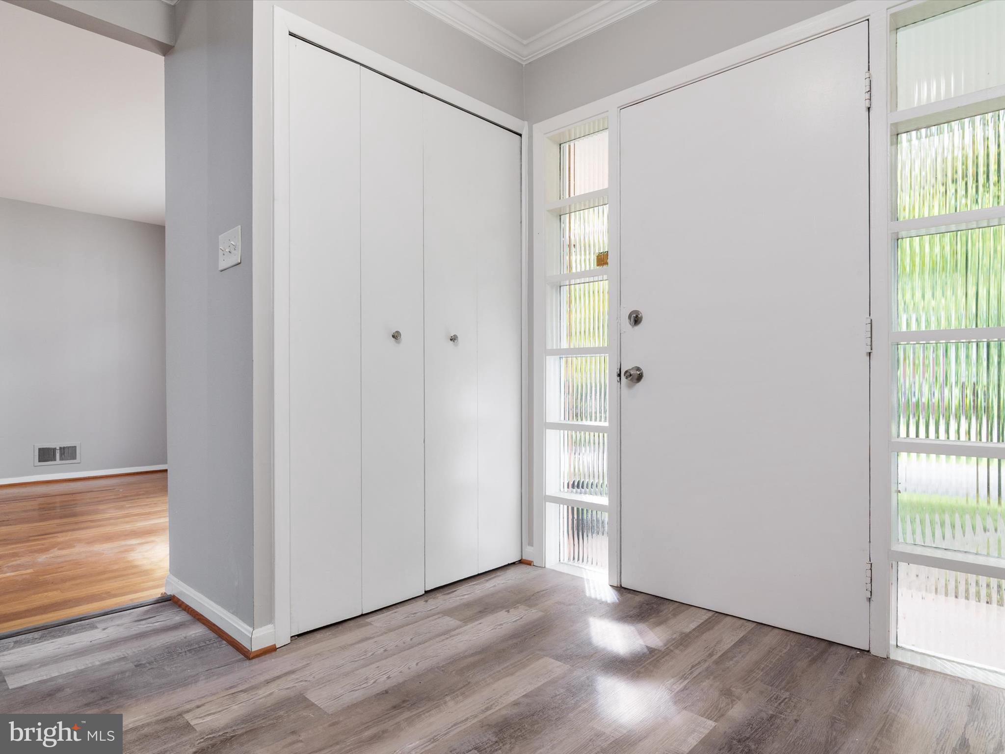 806 Downs Drive Silver Spring, MD 20904 - Photo 6 of 36 a view of an empty room with wooden floor and a window