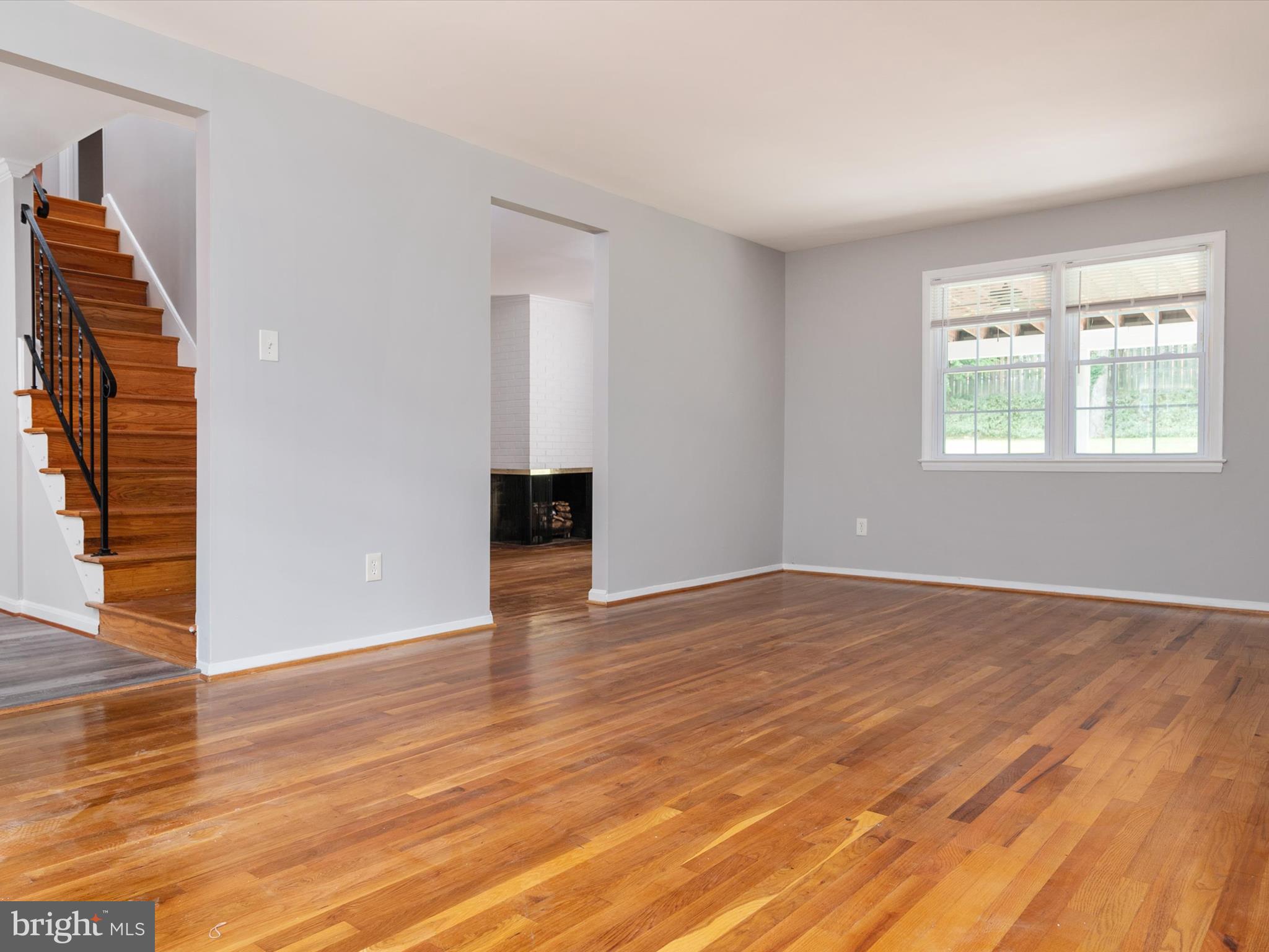 806 Downs Drive Silver Spring, MD 20904 - Photo 9 of 36 an empty room with wooden floor and windows