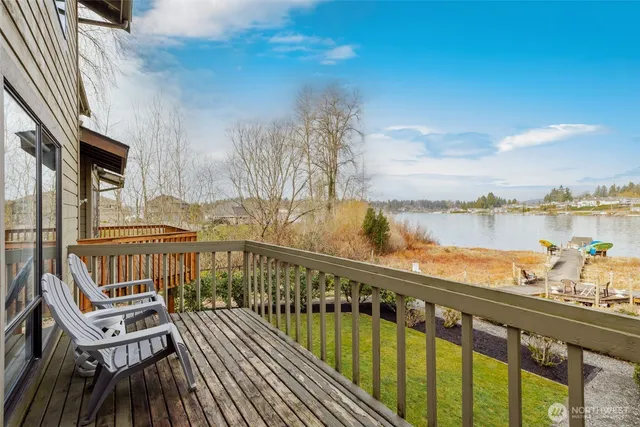 a bathroom with a sink shower and a mirror