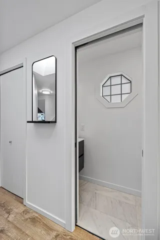 a bedroom with a large bed and a large window