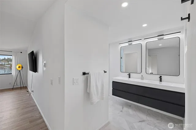 a view of a lake with houses in the back