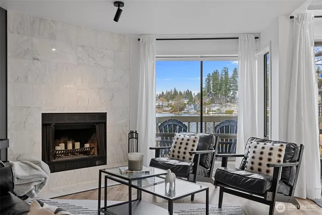 a view of a balcony with wooden chairs and wooden floor