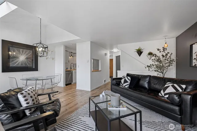 a bedroom with a bed a mirror and dresser