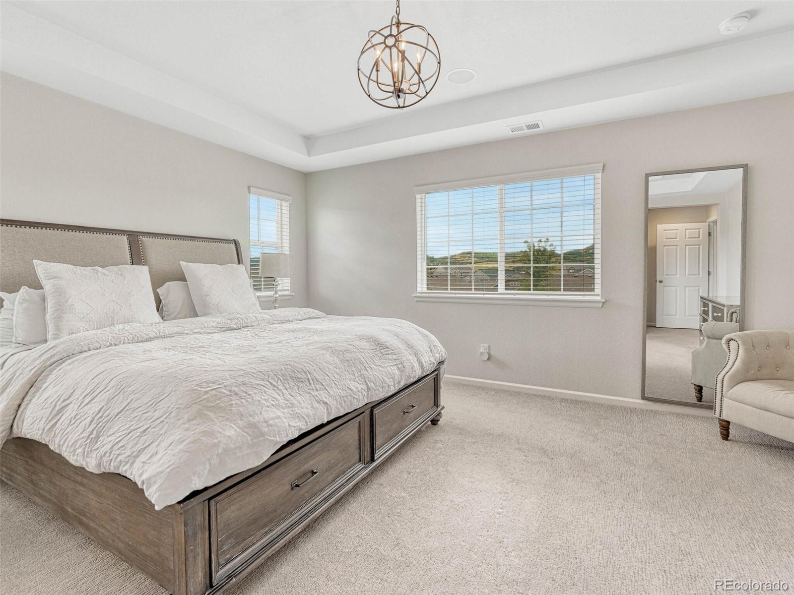 5921 Berry Ridge Wy. Castle Rock, CO 80104 - Photo 20 of 43 a bedroom with a bed and window