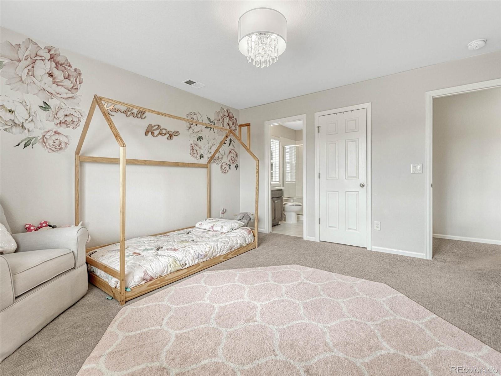 5921 Berry Ridge Wy. Castle Rock, CO 80104 - Photo 27 of 43 a spacious bedroom with a bed and a window