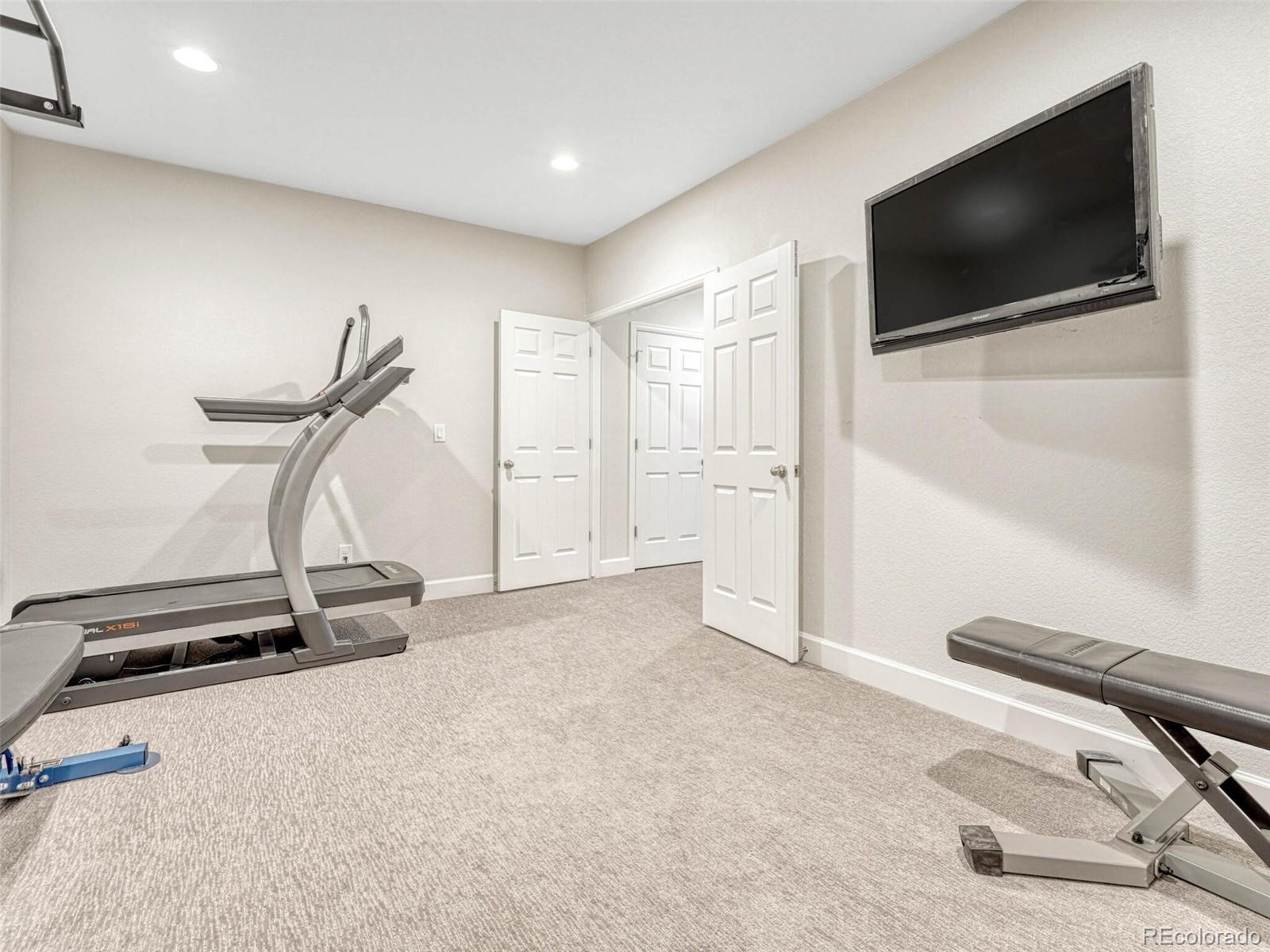 5921 Berry Ridge Wy. Castle Rock, CO 80104 - Photo 35 of 43 a view of a room with gym equipment
