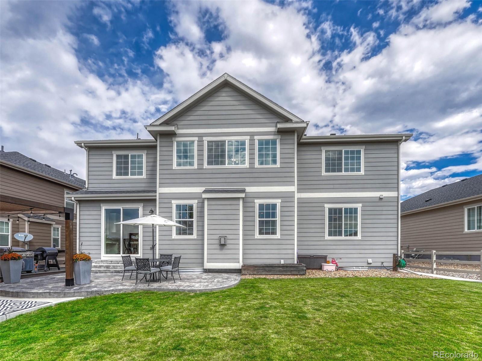 5921 Berry Ridge Wy. Castle Rock, CO 80104 - Photo 41 of 43 a front view of house with yard and outdoor seating