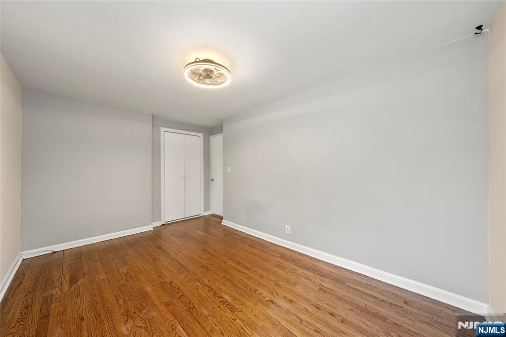 44 Knickerbocker Road Cresskill, NJ 07626 - Photo 17 of 26 a view of an empty room with wooden floor