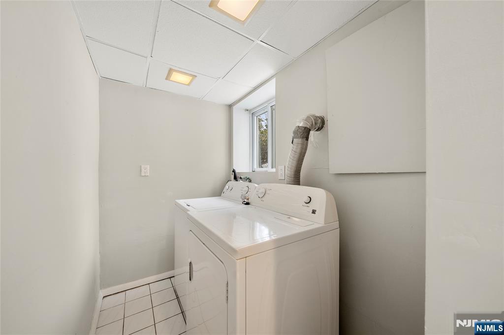 44 Knickerbocker Road Cresskill, NJ 07626 - Photo 22 of 26 a bathroom with a sink and a mirror