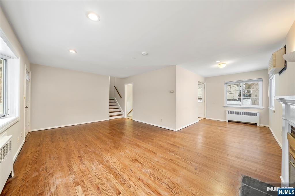 44 Knickerbocker Road Cresskill, NJ 07626 - Photo 5 of 26 a view of empty room with wooden floor and window