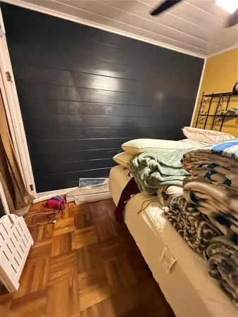 a bed sitting in a bedroom next to a window
