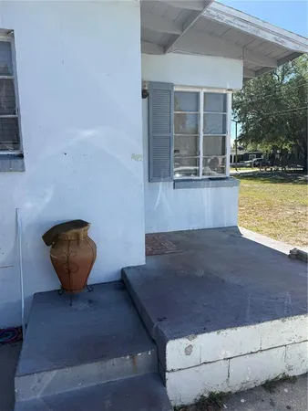 a view of a floor to ceiling window and an outdoor space