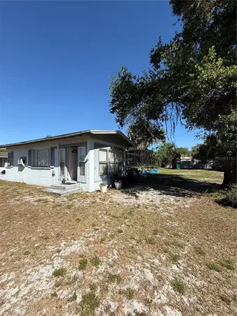 a front view of house with yard and seating area
