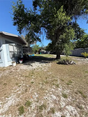 a view of a backyard of the house