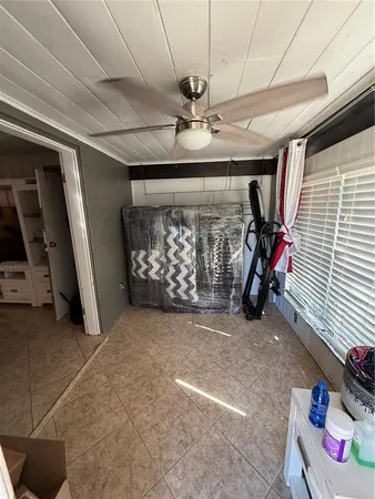 a view of an empty room with storage