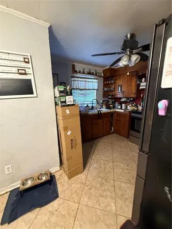 a kitchen with refrigerator and window