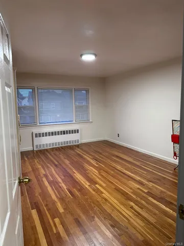 a view of a room with a wooden floor