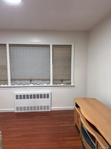 a view of kitchen with wooden floor