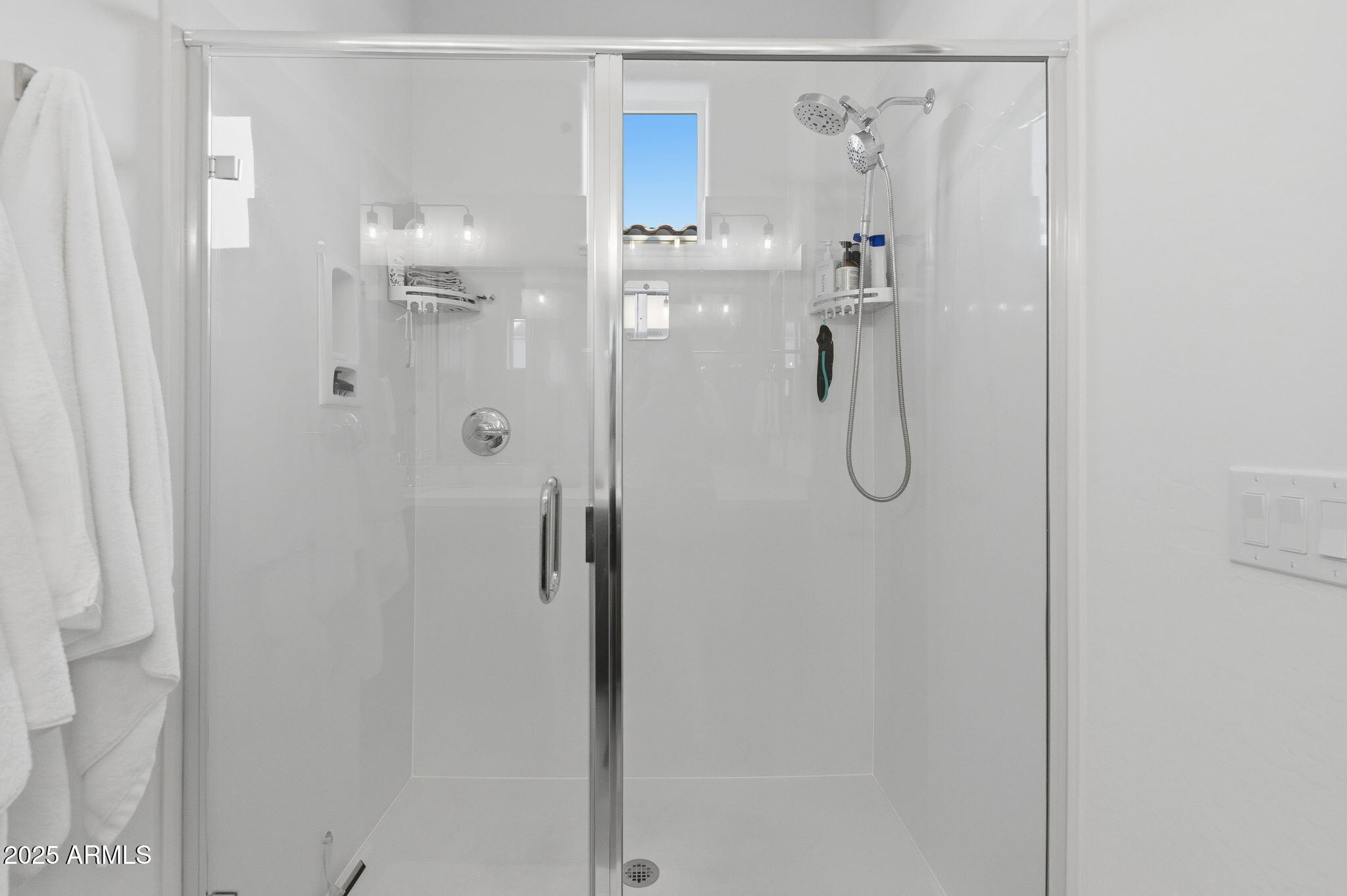 2142 West Hide Trail Phoenix, AZ 85085 - Photo 13 of 81 a bathroom with a glass shower door