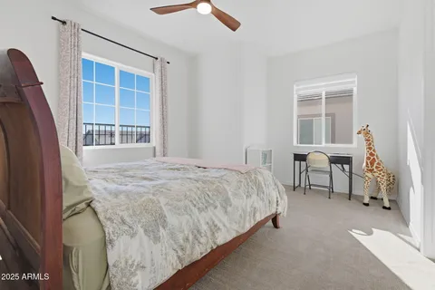 a bathroom with a sink a toilet a mirror and shower