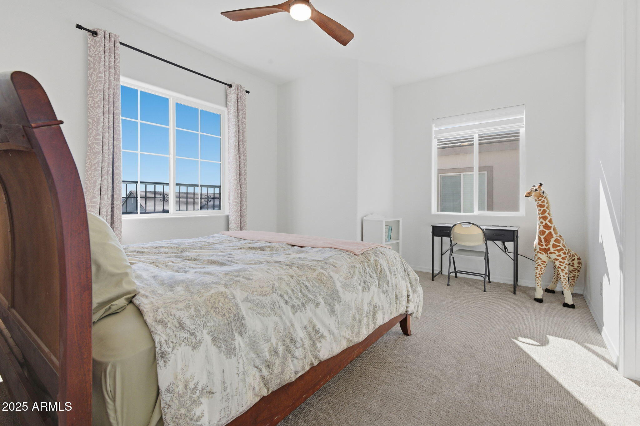 2142 West Hide Trail Phoenix, AZ 85085 - Photo 19 of 81 a bedroom with a bed and a window