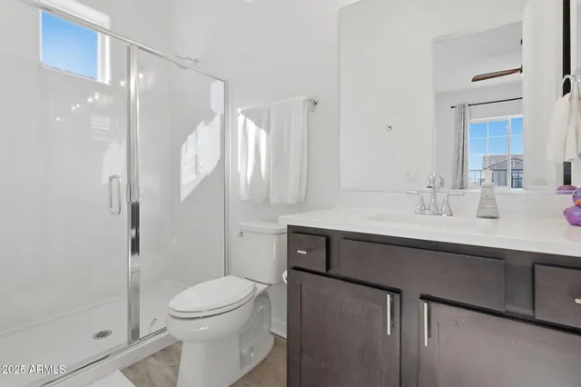 a view of a livingroom with furniture and a window