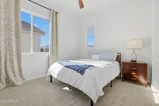 a view of a patio with table and chairs and potted plants