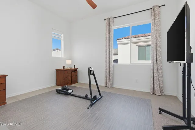 a view of a patio with table and chairs and potted plants