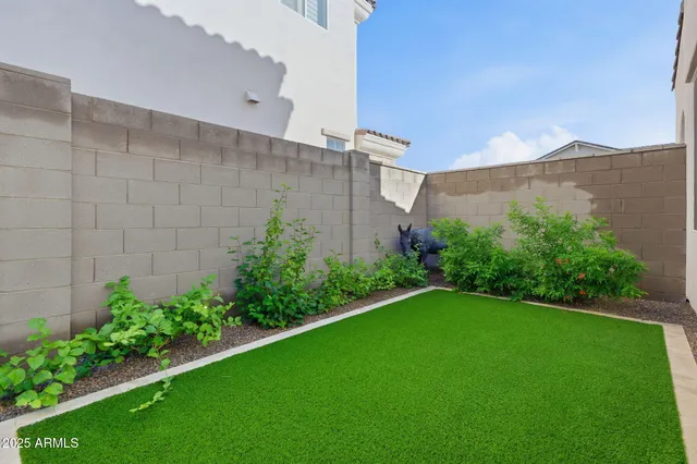 a view of a livingroom with furniture and a flat screen tv