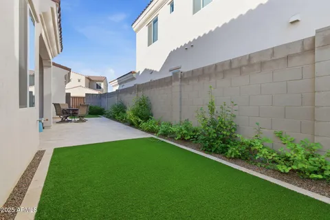 a view of a dining area with furniture and chandelier