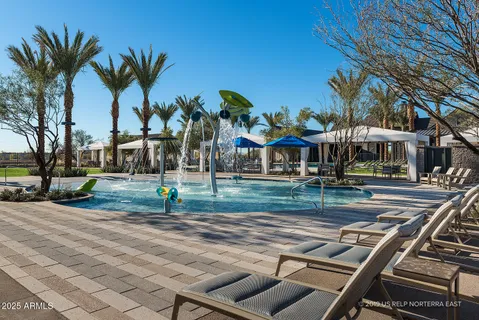 a view of a swimming pool and a yard