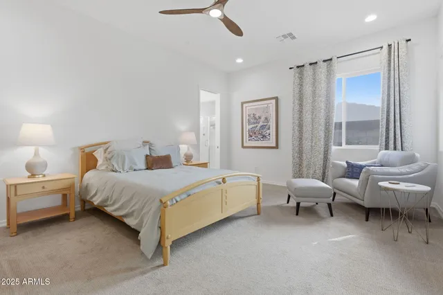 a spacious bathroom with a double vanity sink and a mirror