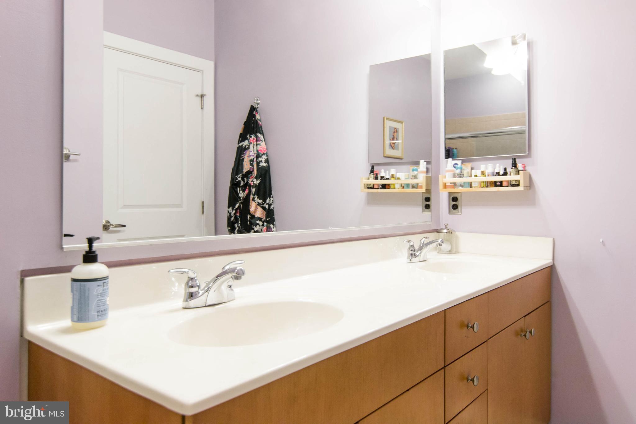 2007 Clipper Park Road, Unit 319 Baltimore, MD 21211 - Photo 22 of 29 a bathroom with a sink and a mirror