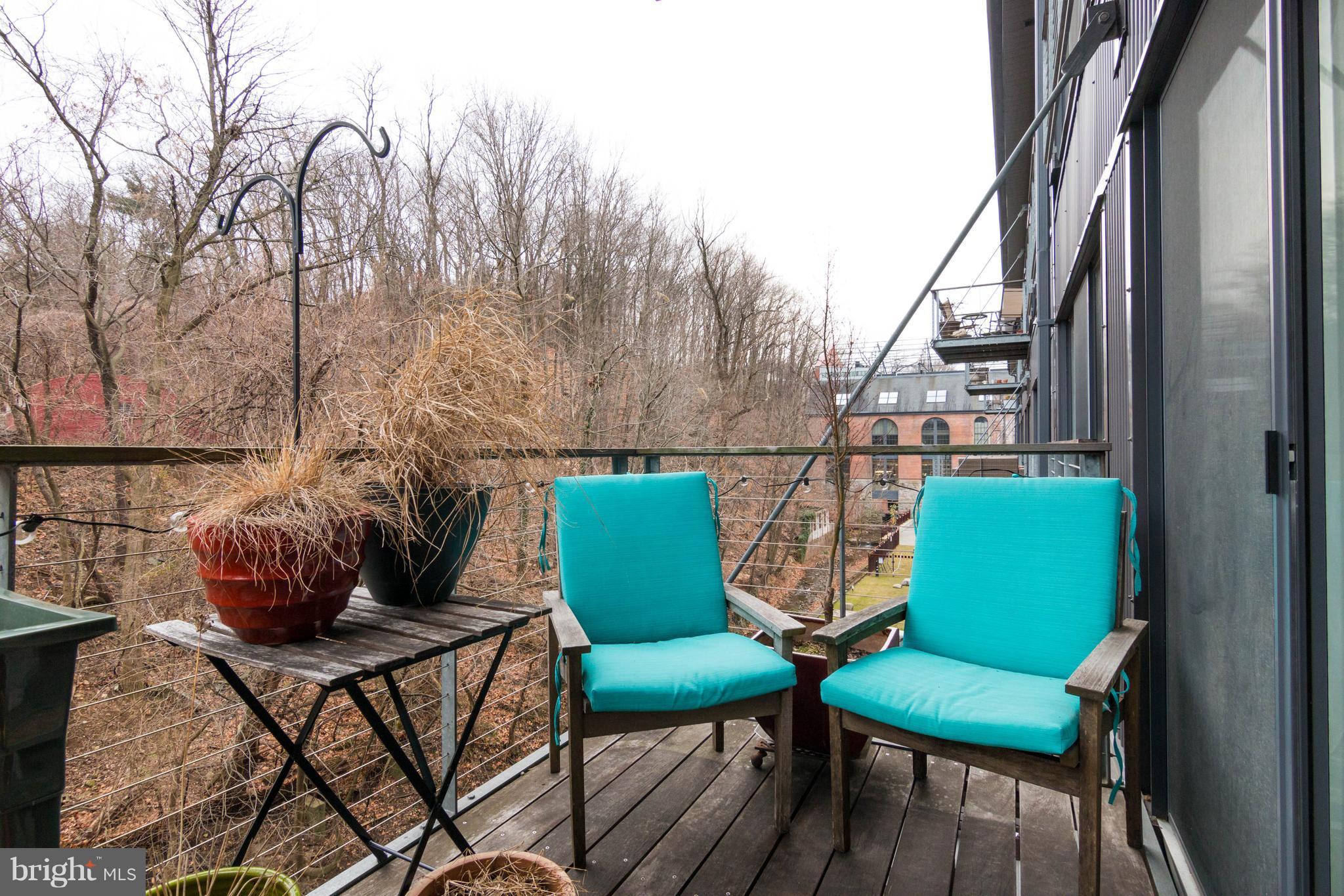 2007 Clipper Park Road, Unit 319 Baltimore, MD 21211 - Photo 28 of 29 a balcony with furniture and a potted plant