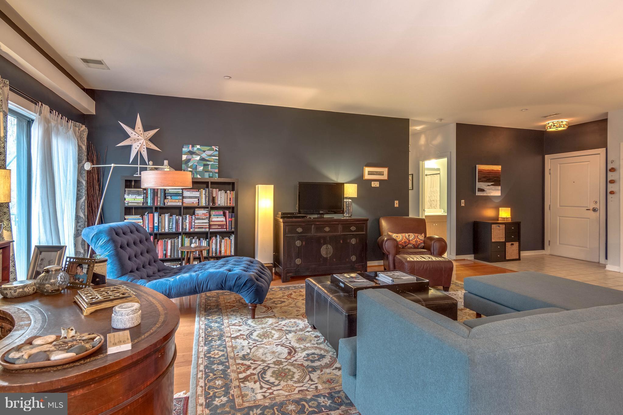 2007 Clipper Park Road, Unit 319 Baltimore, MD 21211 - Photo 6 of 29 a living room with furniture and a wooden floor