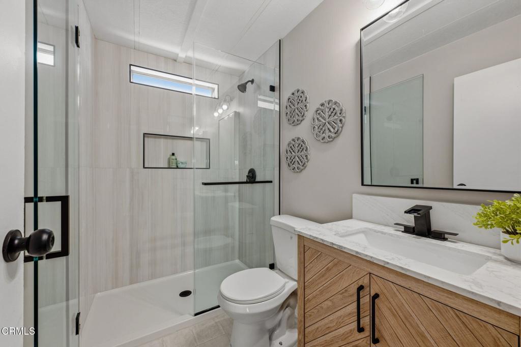 4700 Aurora Drive, Unit 16 Ventura, CA 93003 - Photo 15 of 28 a bathroom with a sink toilet and shower