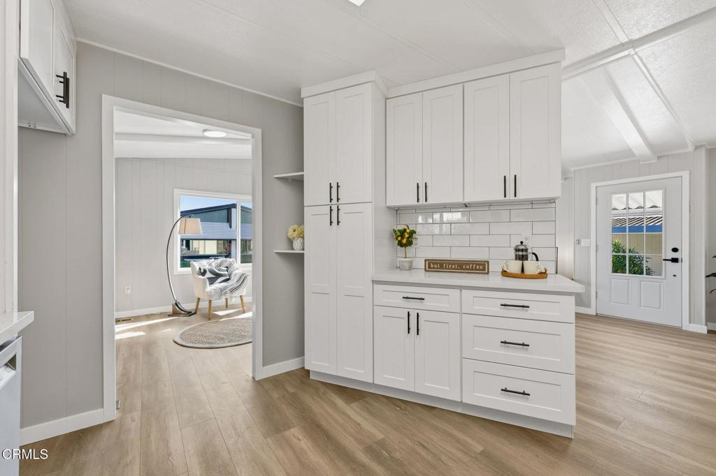 4700 Aurora Drive, Unit 16 Ventura, CA 93003 - Photo 19 of 28 a kitchen with stainless steel appliances a refrigerator and cabinets