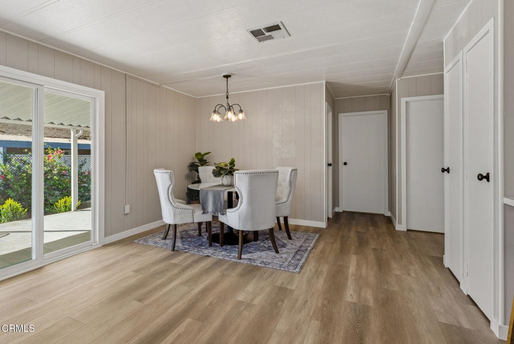 4700 Aurora Drive, Unit 16 Ventura, CA 93003 - Photo 20 of 28 a view of a dining room with furniture window and wooden floor