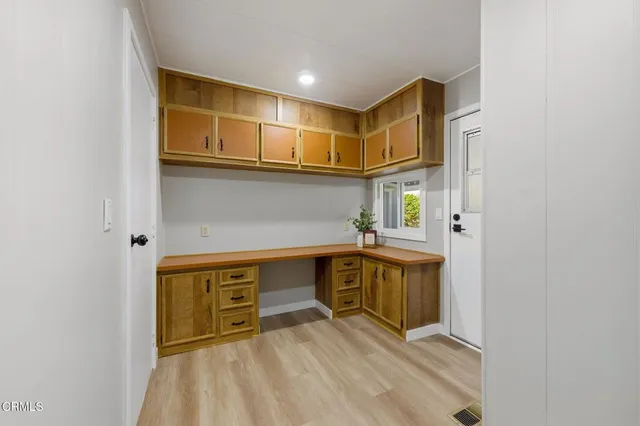 a kitchen with stainless steel appliances a sink and cabinets
