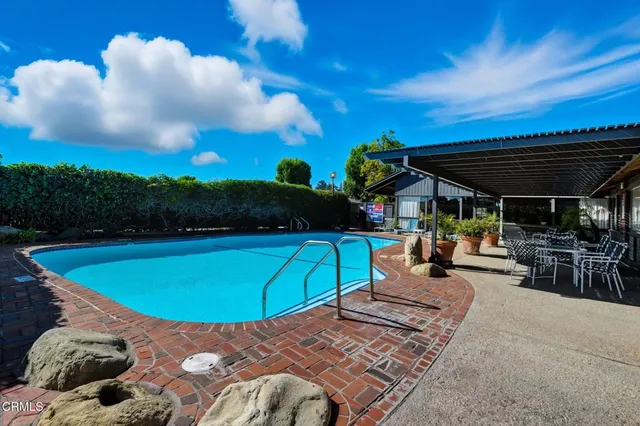 a view of a swimming pool with a patio